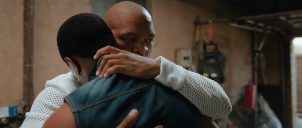 Bonga comforting his friend Eric in Adulting