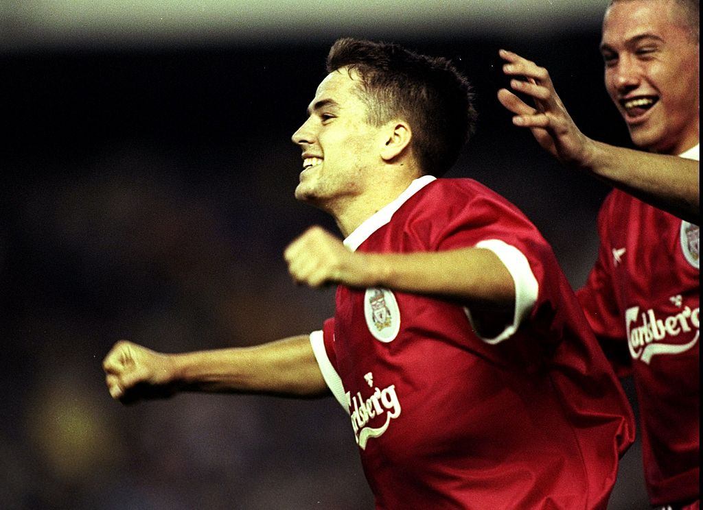 Michael Owen of Liverpool celebrates his part in a goal with team mate Sean Dundee against Valencia during the UEFA Cup second round second leg tie at the Mestalla Stadium in Valencia, Spain