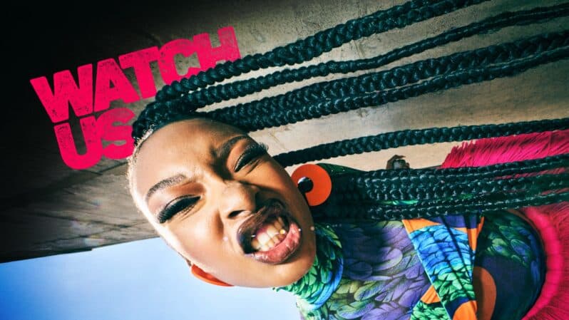 Fierce woman with dreadlocks confronting the camera in a Showmax Watch Us Campaign still