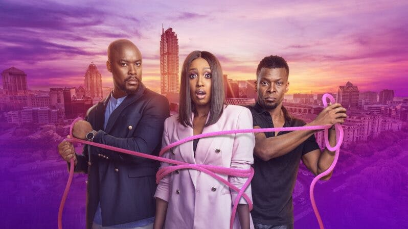 Two men with a pink rope around a woman in a suit; from drama series Entangled on Showmax