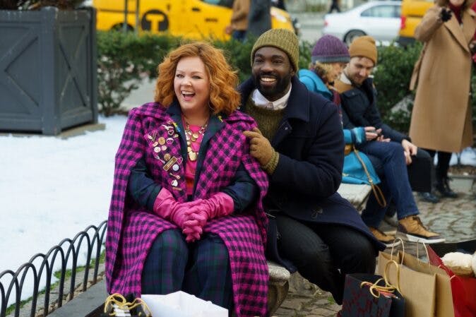 (from left) Flora (Melissa McCarthy) and Bernard (Paapa Essiedu) in Genie, directed by Sam Boyd, on Showmax