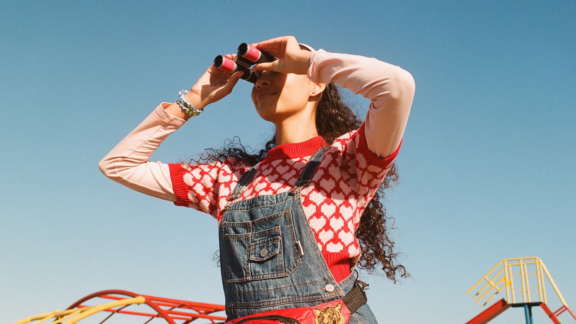 A still from Finding Optel showing Claire looking through binoculars